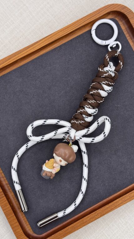 White & brown bag charm